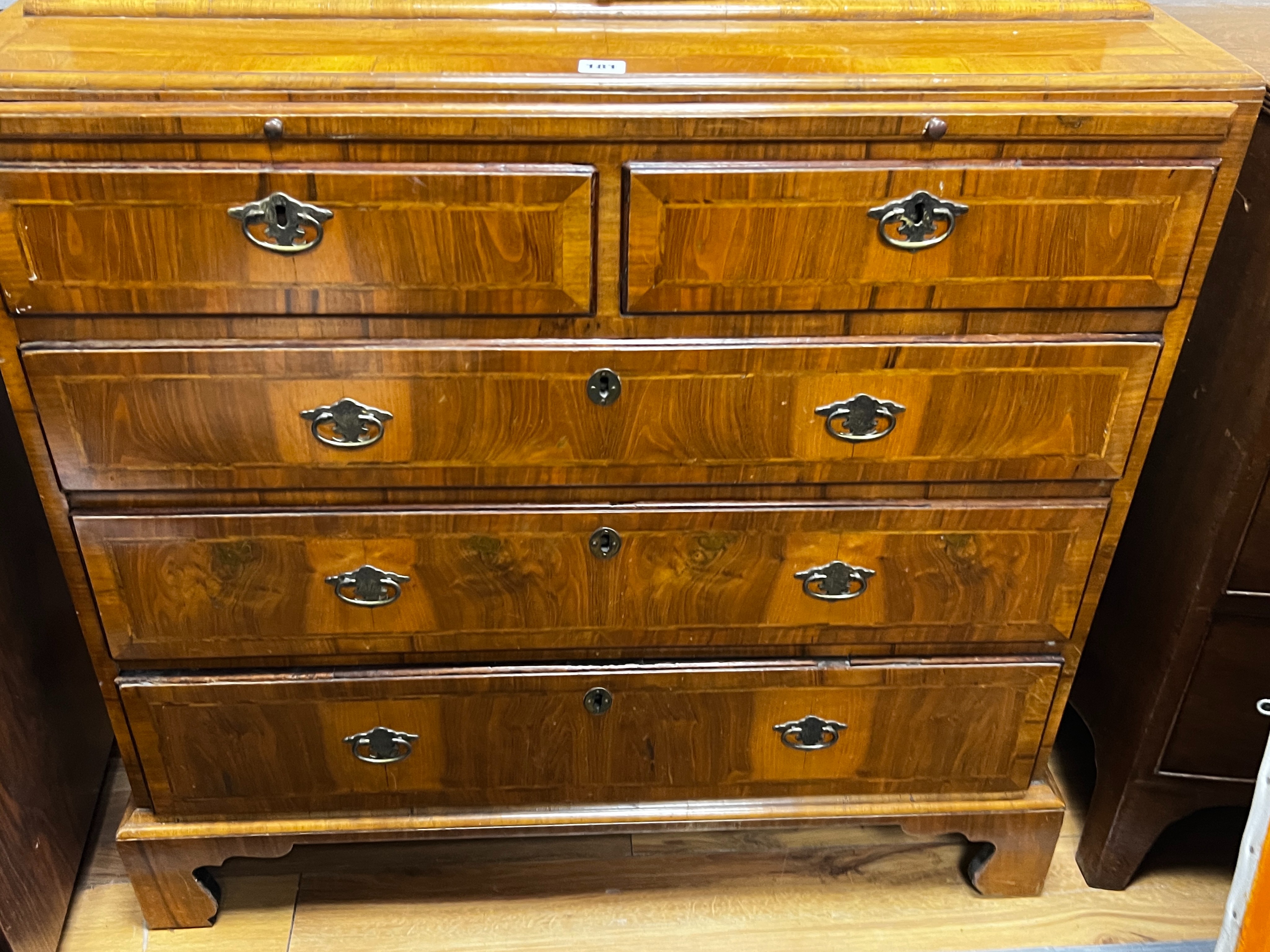 A Queen Anne revival feather banded walnut cabinet on chest, width 91cm, depth 47cm, height 193cm